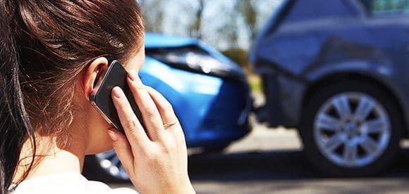 lady on phone auto accident chiropractic treatment el paso tx