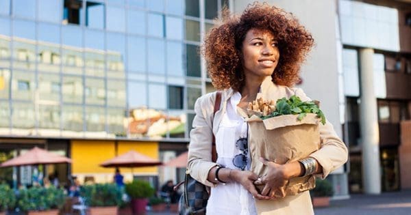 blog picture of lady with groceries smiling