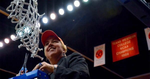 blog picture of basketball coach cutting net