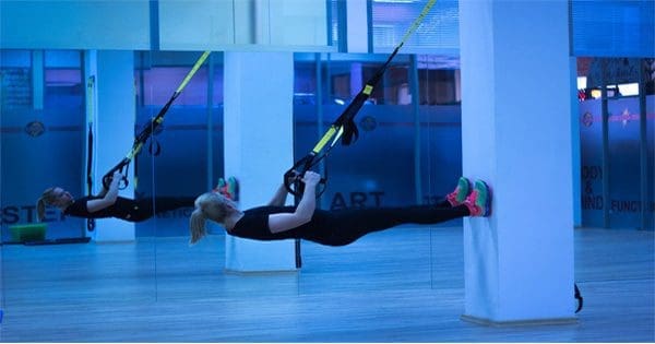 blog picture of lady working out in studio with bands