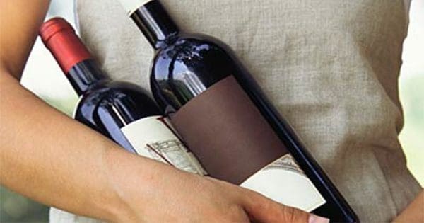 wine bottles being held