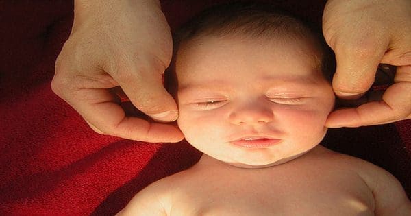 baby being checked by chiropractor