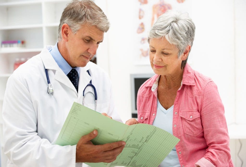 Doctor reviews chronic kidney disease life expectancy statistics with patient.